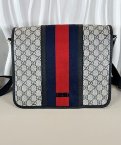 Alternative view of Gucci GG Plus Monogram messenger bag in beige and navy, featuring the signature red and blue Web stripe.