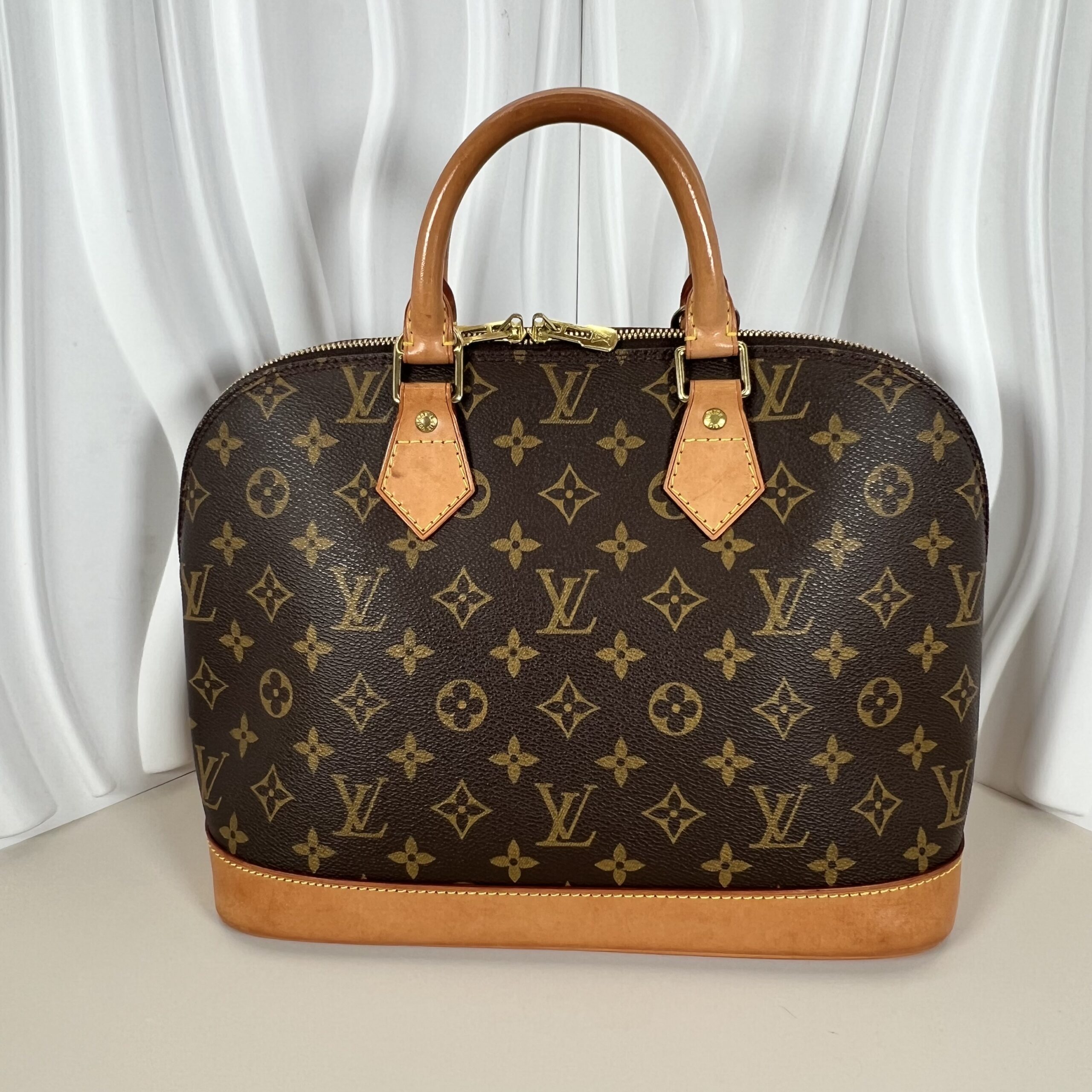 Louis Vuitton Monogram Alma PM Handbag