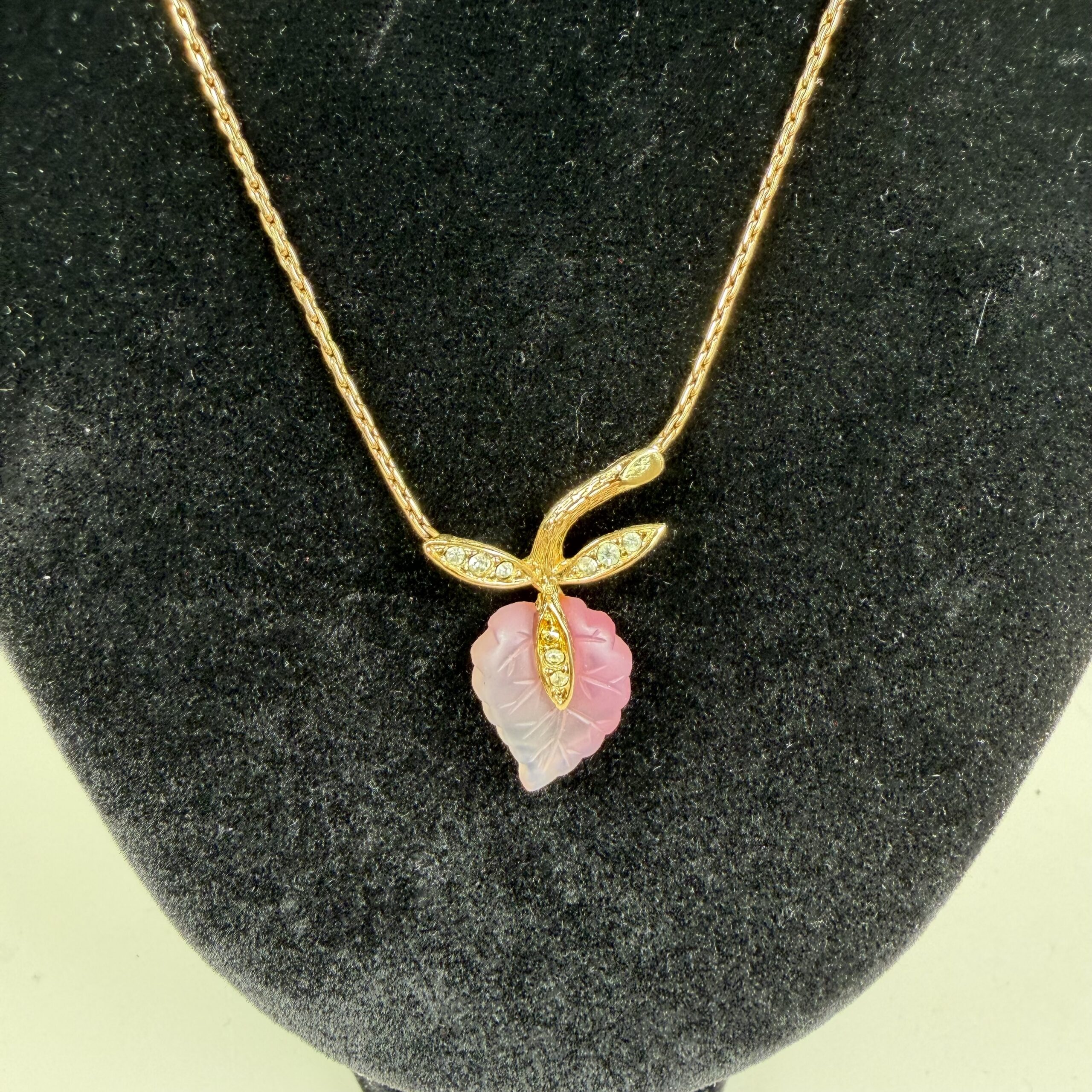 Christian Dior vintage featuring a signature pink leaf design.