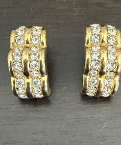 Swarovski crystal half-hoop earrings.