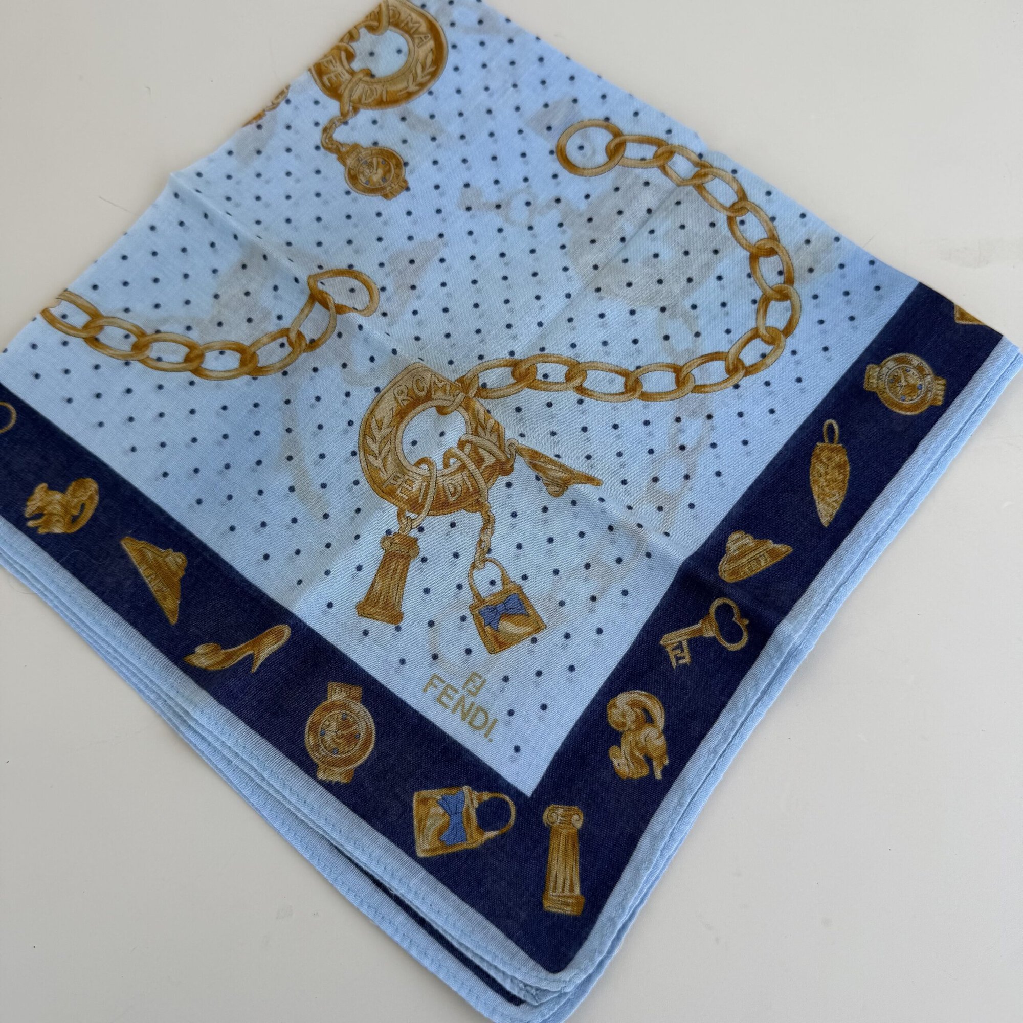 Fendi Roma handkerchief scarf featuring a beautiful gold chain and luxury jewelry charm print