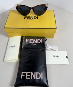 Overview of Fendi monogram sunglasses with original presentation box, pouch, and documents