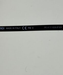 Close-up of inner right temple arm stamped Fendi Made in Italy CE and etched serial number