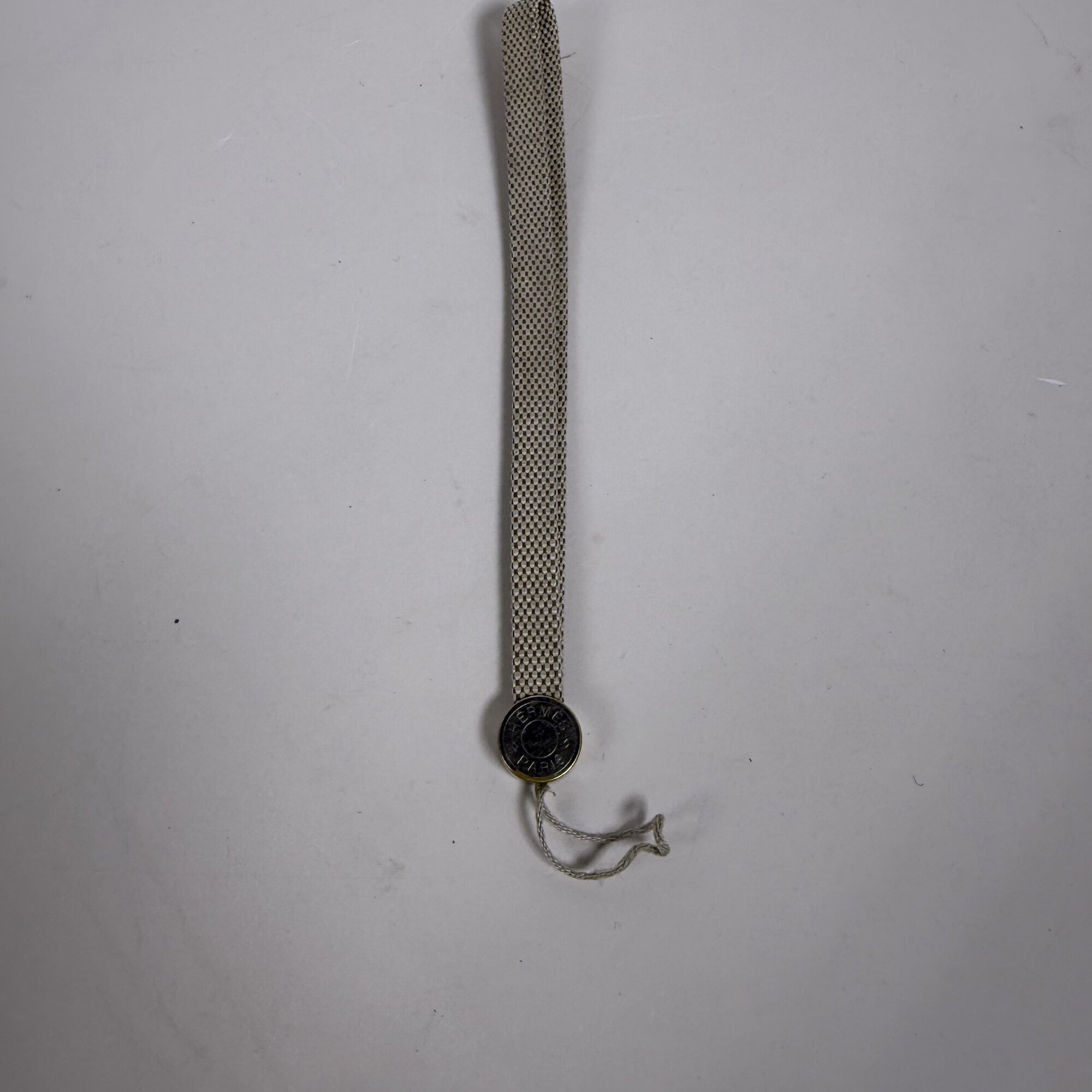 Hermes Vintage Grooming / Key Ring Clou de Selle Silver Tone Logo Woven Cord Strap Charm