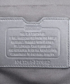 Close-up of Coach leather creed patch debossed with number L1261-F70692