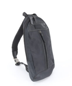 Side profile view of Coach black sling pack showing padded strap