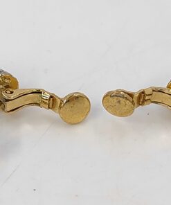 Close-up of the round contact pads on the paddle clips of the Givenchy clip-on earrings.