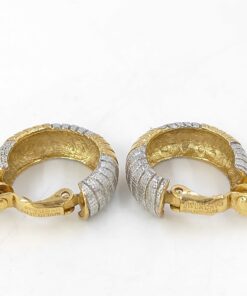 Rear view of Givenchy ribbed hoop clip-on earrings showing open-back construction and stamped paddle clips.