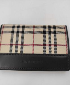 Front view of Burberry folding card case featuring Nova Check canvas and debossed dark brown leather trim.