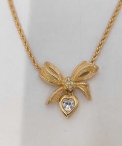 Christian Dior gold-tone bow pendant necklace with clear crystal heart charm
