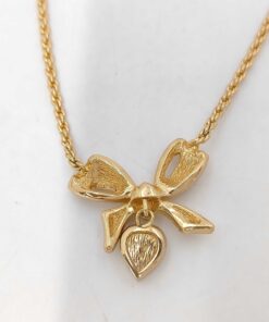 Back of Christian Dior gold-tone bow and heart pendant necklace