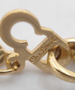 Close-up of Christian Dior hallmark stamp on fold-over necklace clasp