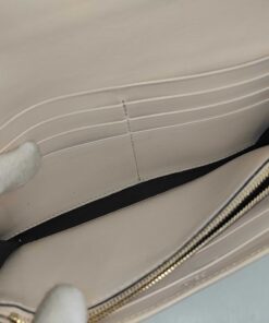 Interior compartment of Fendi wallet showing stacked leather card slots and lining.