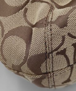 Close-up view of corner seam and khaki signature C jacquard canvas.
