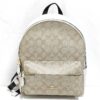 Front view of Coach Medium Charlie backpack in khaki signature canvas and chalk white leather