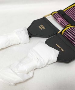 Detail of black leather anchor tabs showing FENDI ROMA and MADE IN ITALY gold foil stamping.