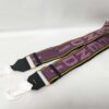 Full view of Fendi purple and pink woven logo Strap You shoulder strap with tissue-wrapped clips.