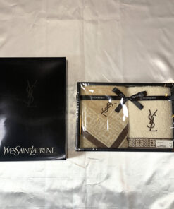 Yves Saint Laurent 2-piece guest towel set in box with black monogram lid beside it