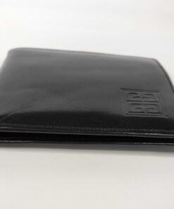Side edge view of folded Givenchy Monsieur black leather bifold wallet