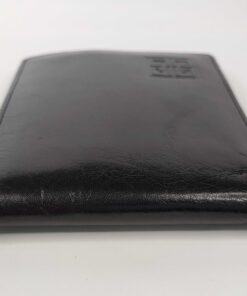 External spine view of the folded Givenchy Monsieur black leather wallet showing light creases
