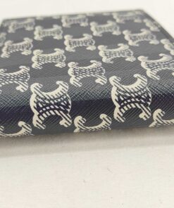 Exterior spine fold of Celine bifold wallet in black Triomphe monogram coated canvas.