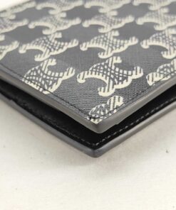 Close-up of exterior corner edge glazing on Celine Triomphe canvas bifold wallet.