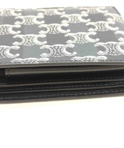 Side profile view of folded Celine bifold wallet showing thickness and edge glazing.