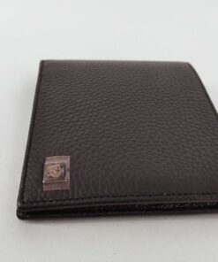 Angled perspective of Dunhill Black bifold wallet showing corner logo plaque.