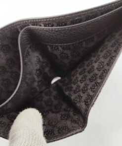 Divided bill compartment of Dunhill wallet lined in monogram crest jacquard textile.
