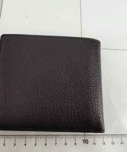 Back exterior of Dunhill black leather wallet on metric measurement grid.