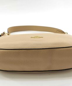Bottom base panel view of Coach Sutton pale gold leather shoulder bag