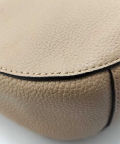 Close-up of bottom corner and edge stitching on pale gold pebble leather