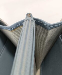 Interior accordion view showing card slots, center zip divider, and textile lining.