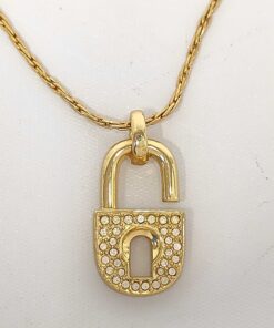 Christian Dior gold-tone padlock pendant necklace with clear pavé accents on front