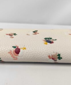 Opposite side profile of folded Coach floral trifold key case.