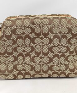 Front view of Coach signature canvas cosmetic pouch in khaki and brown