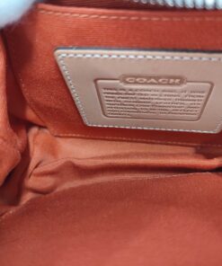Interior compartment showing orange lining and slip pocket