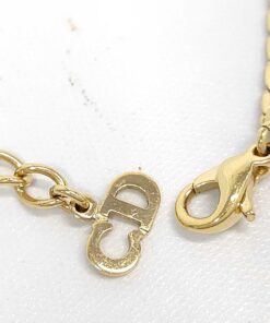 Lobster claw clasp and interlocking CD logo charm on extender chain.