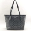 Coach City Zip Tote in black and charcoal signature coated canvas, front view.