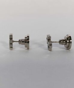 Side view of Tory Burch silver-tone stud earrings with backings attached