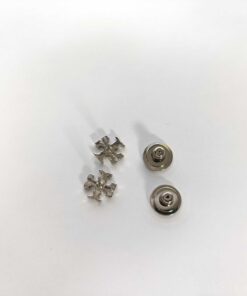 Back view of Tory Burch Double T stud earrings beside disc backings