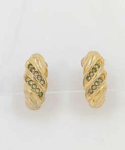 Front view of Christian Dior gold-tone ribbed clip-on earrings with clear stone accents.