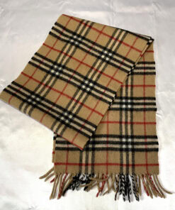 Folded Burberrys Nova Check scarf displaying camel plaid pattern and fringed ends.