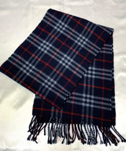 Burberrys navy blue check wool scarf folded lengthwise showing fringed ends.