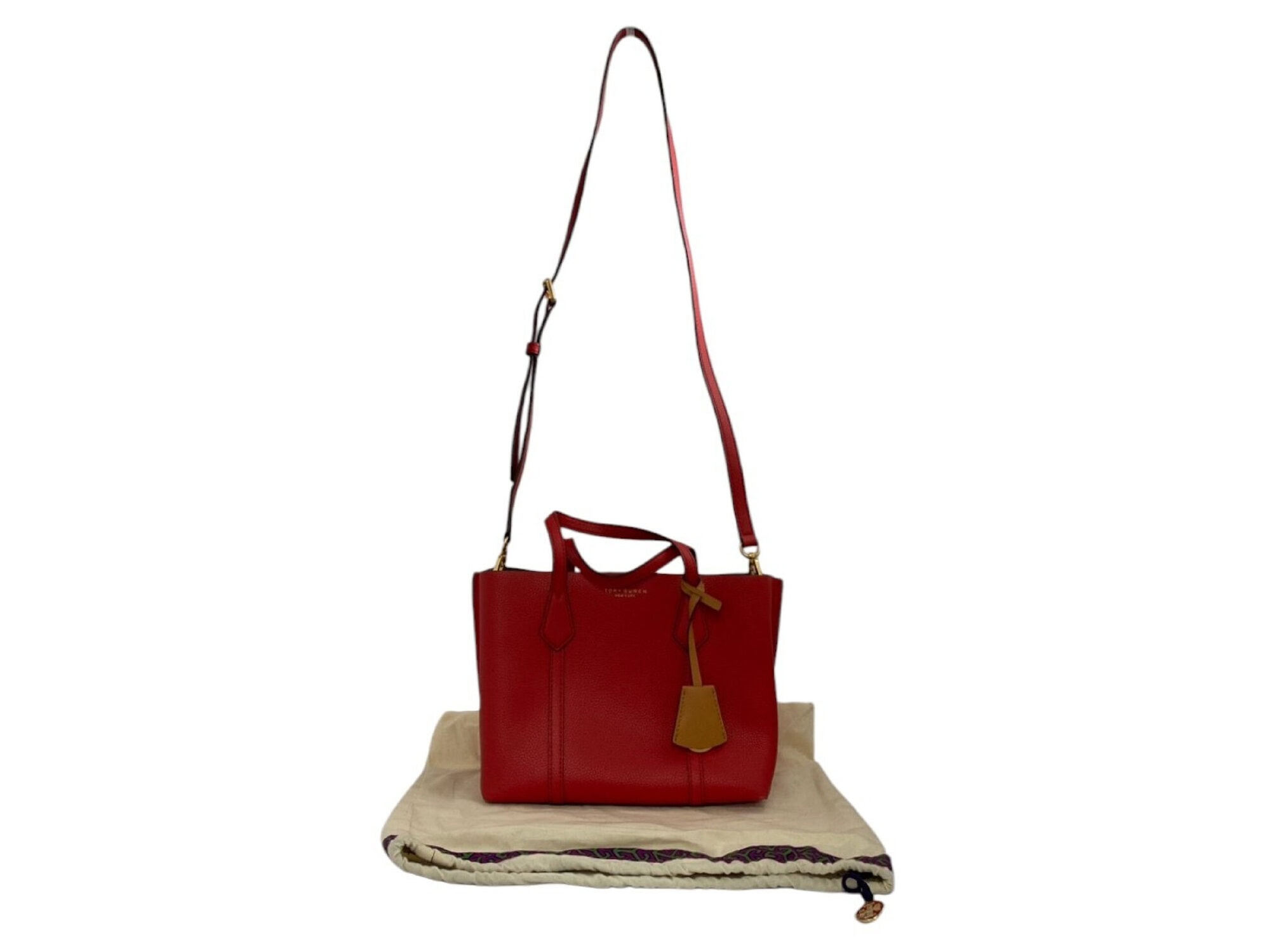Tory Burch red pebbled leather Perry small tote bag on cream dust bag with attached strap and charm