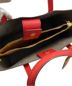 Overhead interior view showing triple compartments, center zip pocket, and snap tab closure