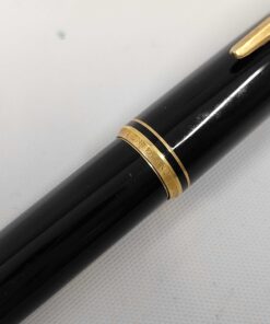 Close-up of gold-tone cap band engraved with MONTBLANC 221