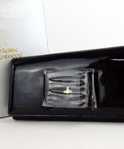 Front view of Vivienne Westwood black patent bow continental wallet with silver box