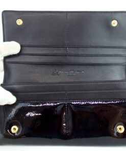 Open interior view showing card slots, dual snap studs, and debossed logo