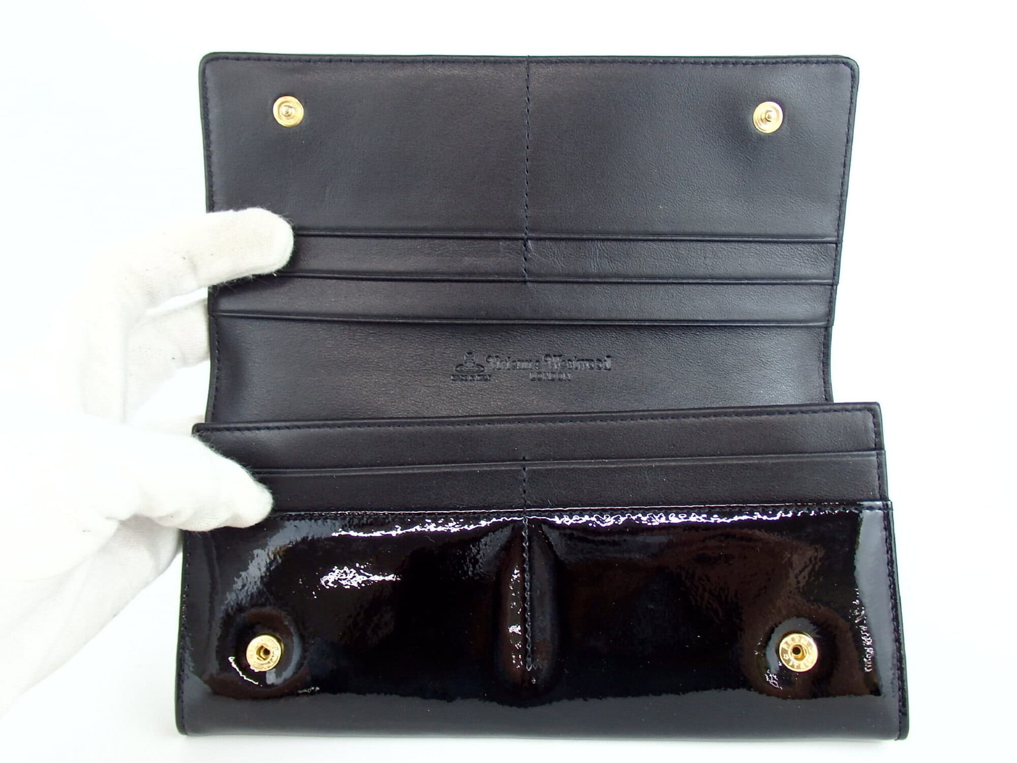 Open interior view showing card slots, dual snap studs, and debossed logo